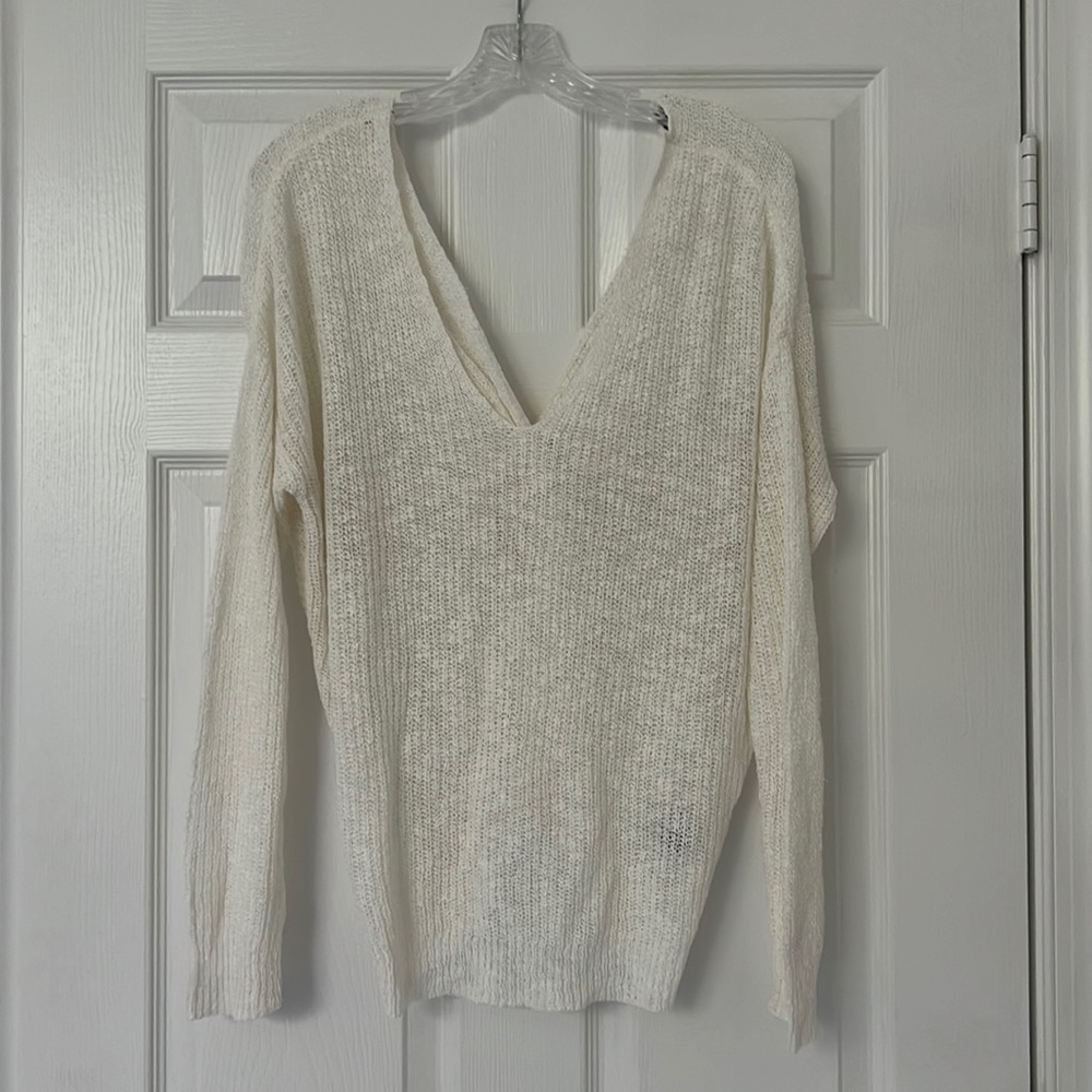 Sheer off-white open back sweater.